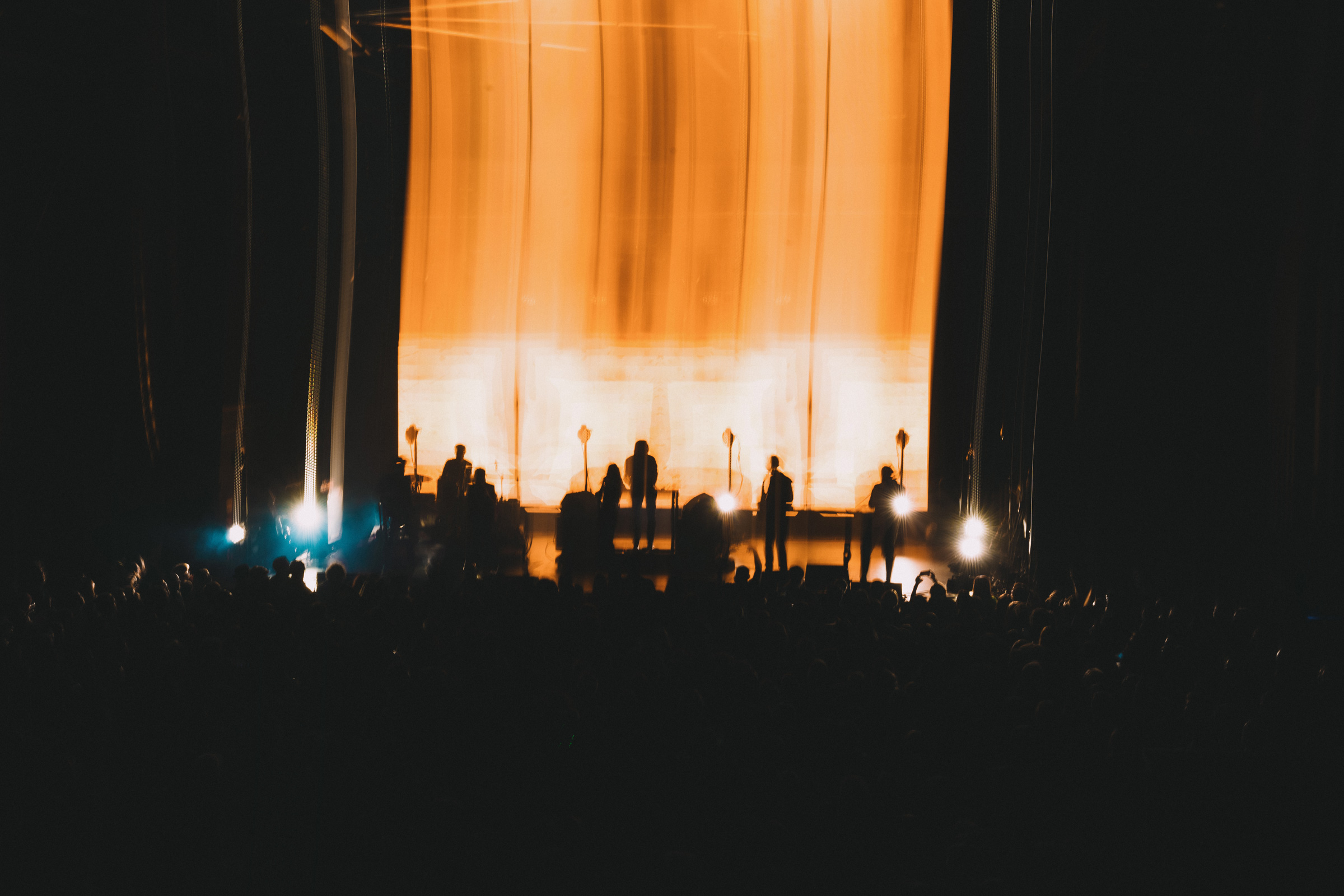 overhead shot of eden on stage lit only by red lights and a cone of red lasers